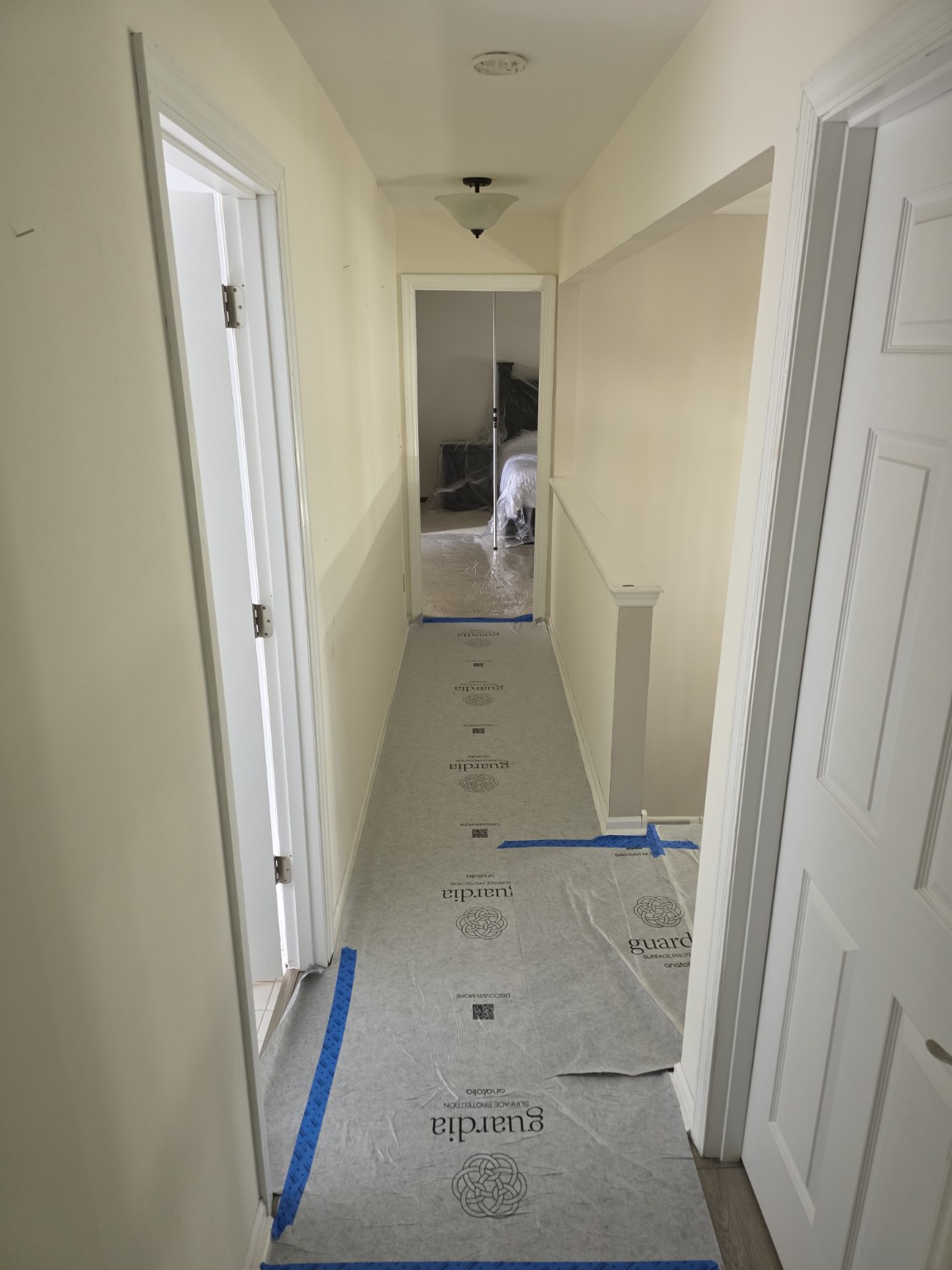 Protected hallway access route prepared before precision interior demolition