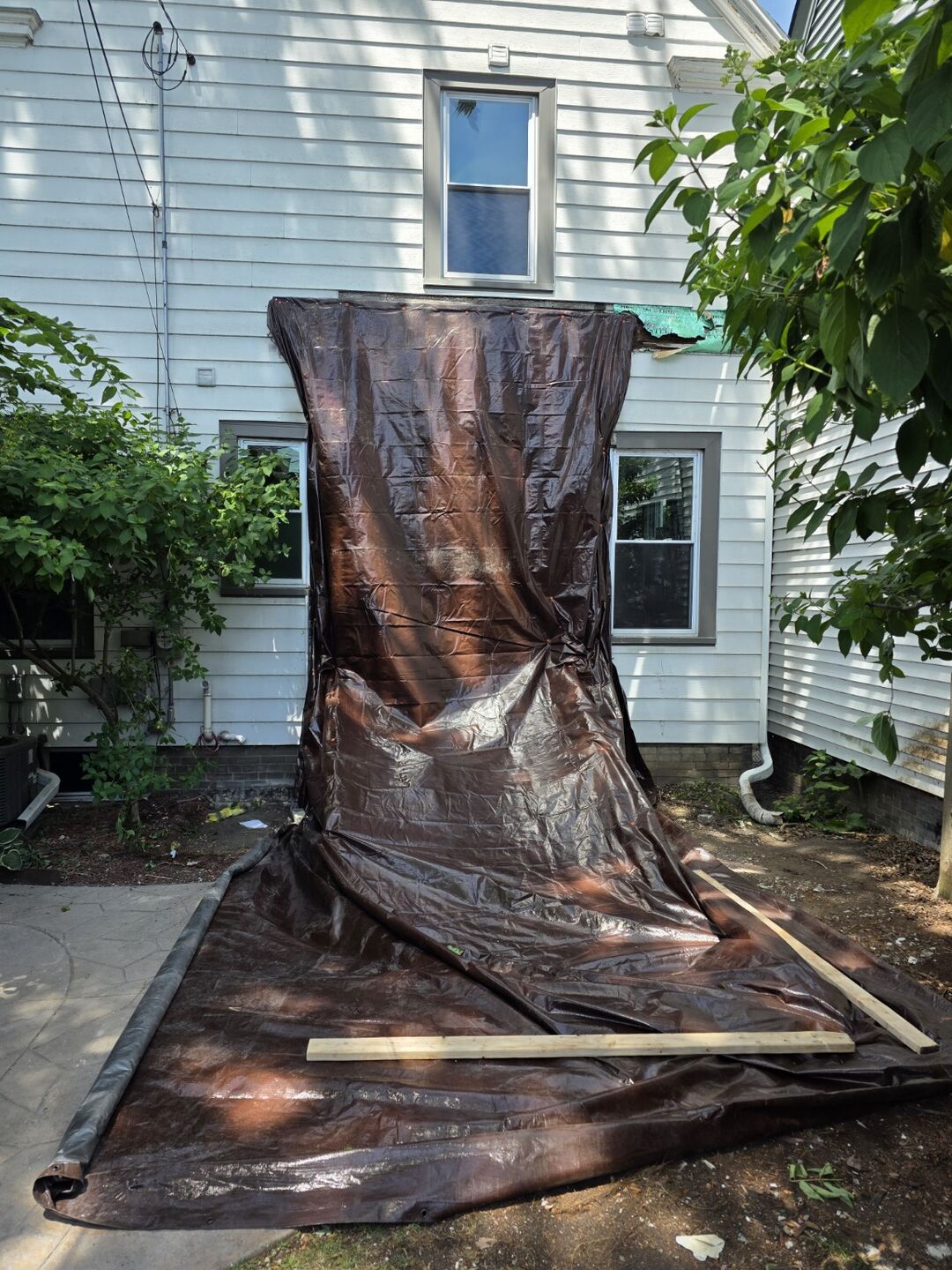 Protective sheeting beside a residential work area
