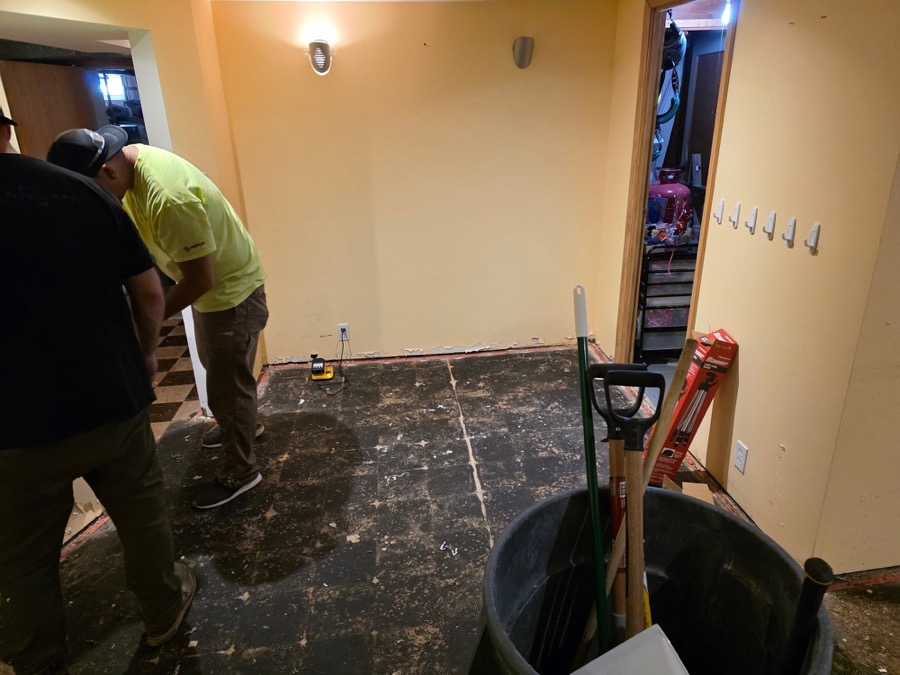 Flooring and tile removal in progress